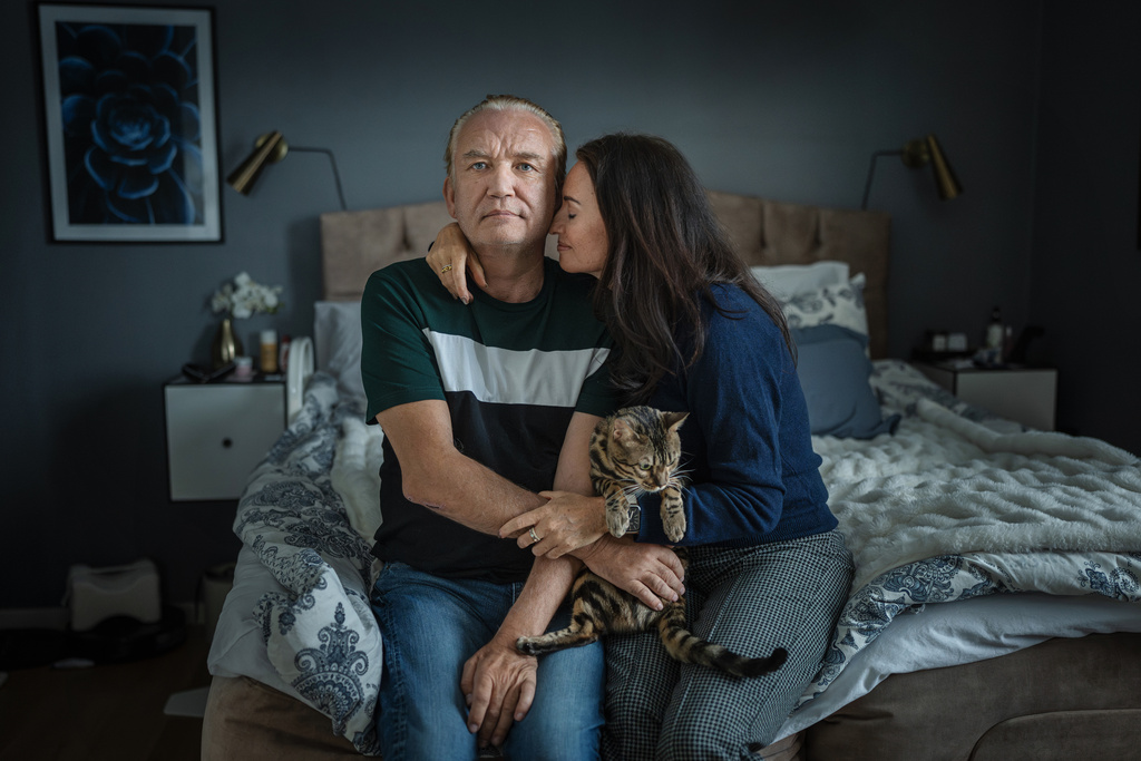 Tom and Tamara sitting together at home